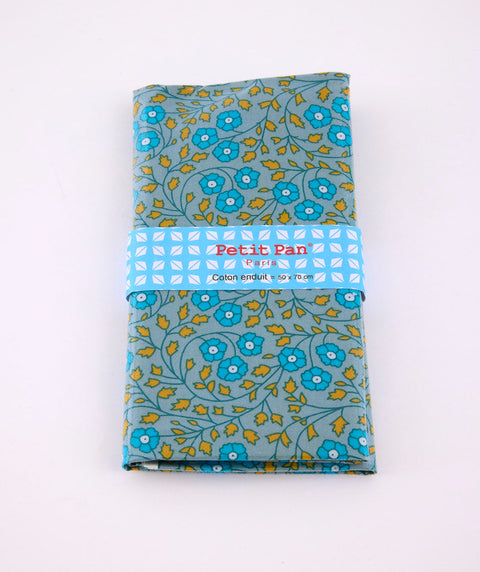Coupon coton enduit gris bleuté avec des motifs fleuris